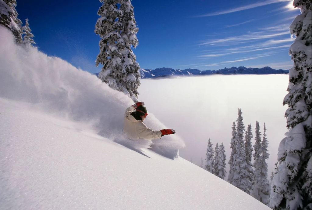 Snowboarding Above The Clouds Wall Mural
